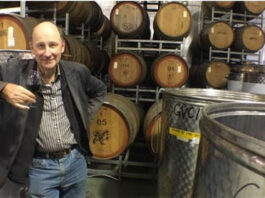 David Farmer among the winery barrels