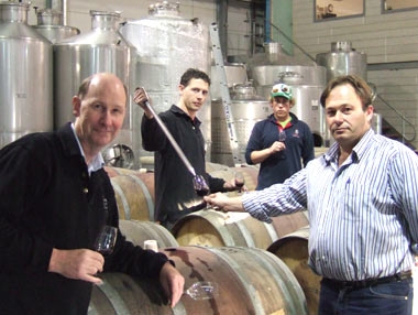 David Farmer, Kym Teusner sampling from the barrel and Rolf Binder in the Veritas winery